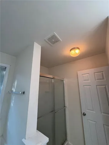 a bathroom with a shower and toilet