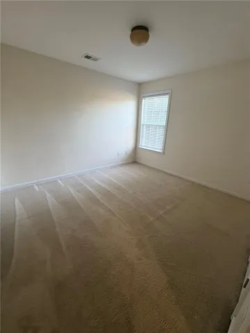 a bathroom with a sink mirror vanity and toilet