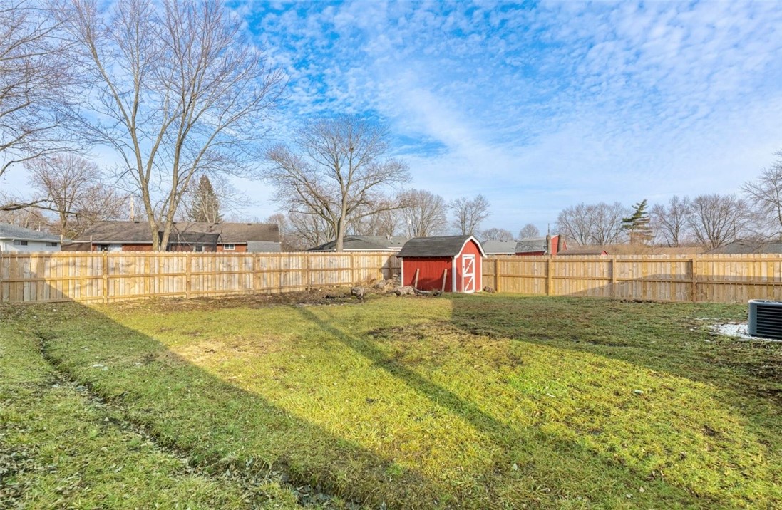 10 Monroe Road Lebanon, OH 45036 - Photo 13 of 14 This spacious yard features a charming red shed and privacy fencing, offering ample outdoor potential.