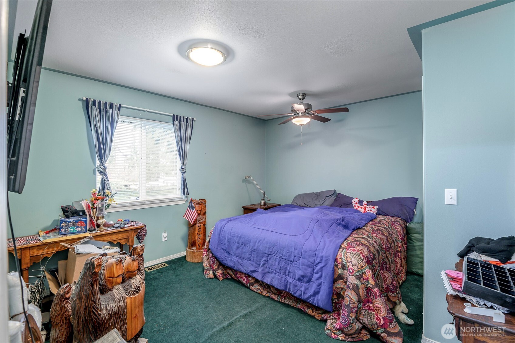 4048 Southeast Horstman Road Port Orchard, WA 98366 - Photo 14 of 40 a bed sitting in a bedroom next to a window