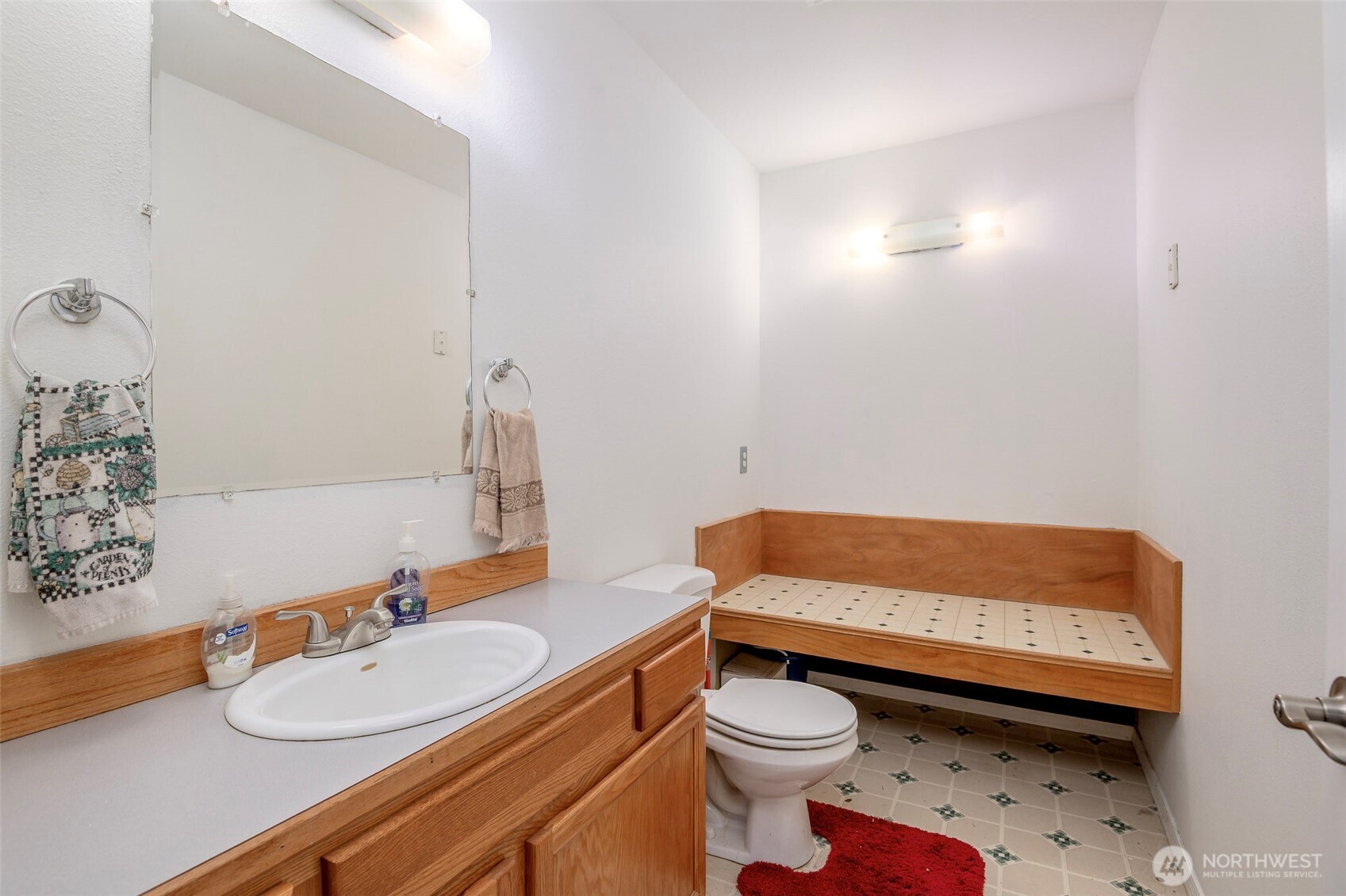 4048 Southeast Horstman Road Port Orchard, WA 98366 - Photo 15 of 40 a bathroom with a sink a toilet and a mirror