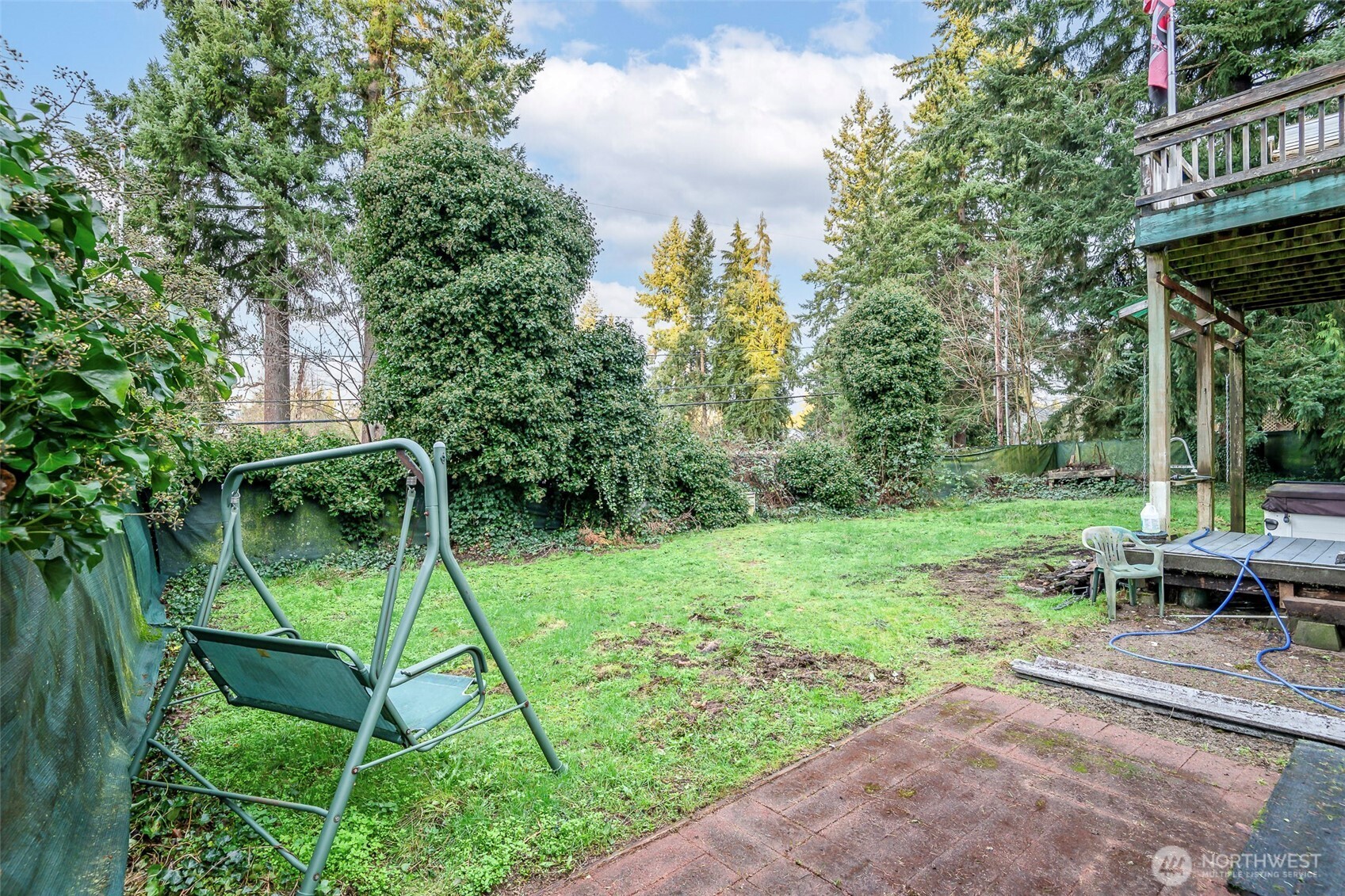 4048 Southeast Horstman Road Port Orchard, WA 98366 - Photo 29 of 40 a backyard of a house with table and chairs