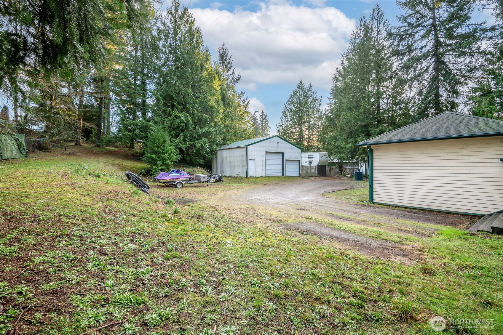 4048 Southeast Horstman Road Port Orchard, WA 98366 - Photo 32 of 40 a view of a backyard with a tree