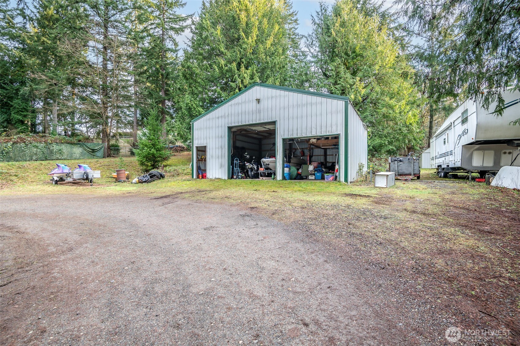 4048 Southeast Horstman Road Port Orchard, WA 98366 - Photo 33 of 40 a front view of a house with a yard and garage