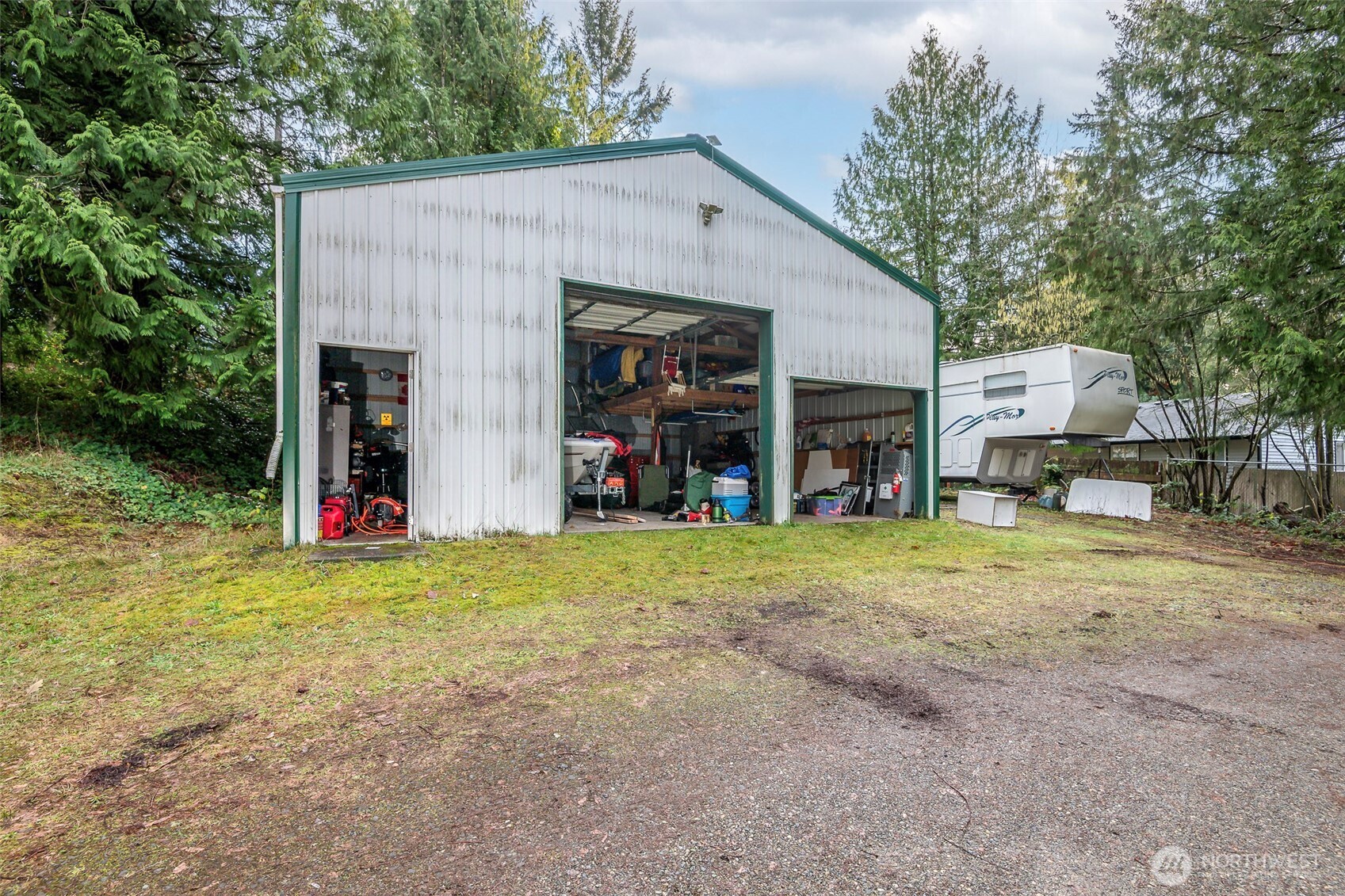 4048 Southeast Horstman Road Port Orchard, WA 98366 - Photo 34 of 40 a view of a house with backyard and entertaining space