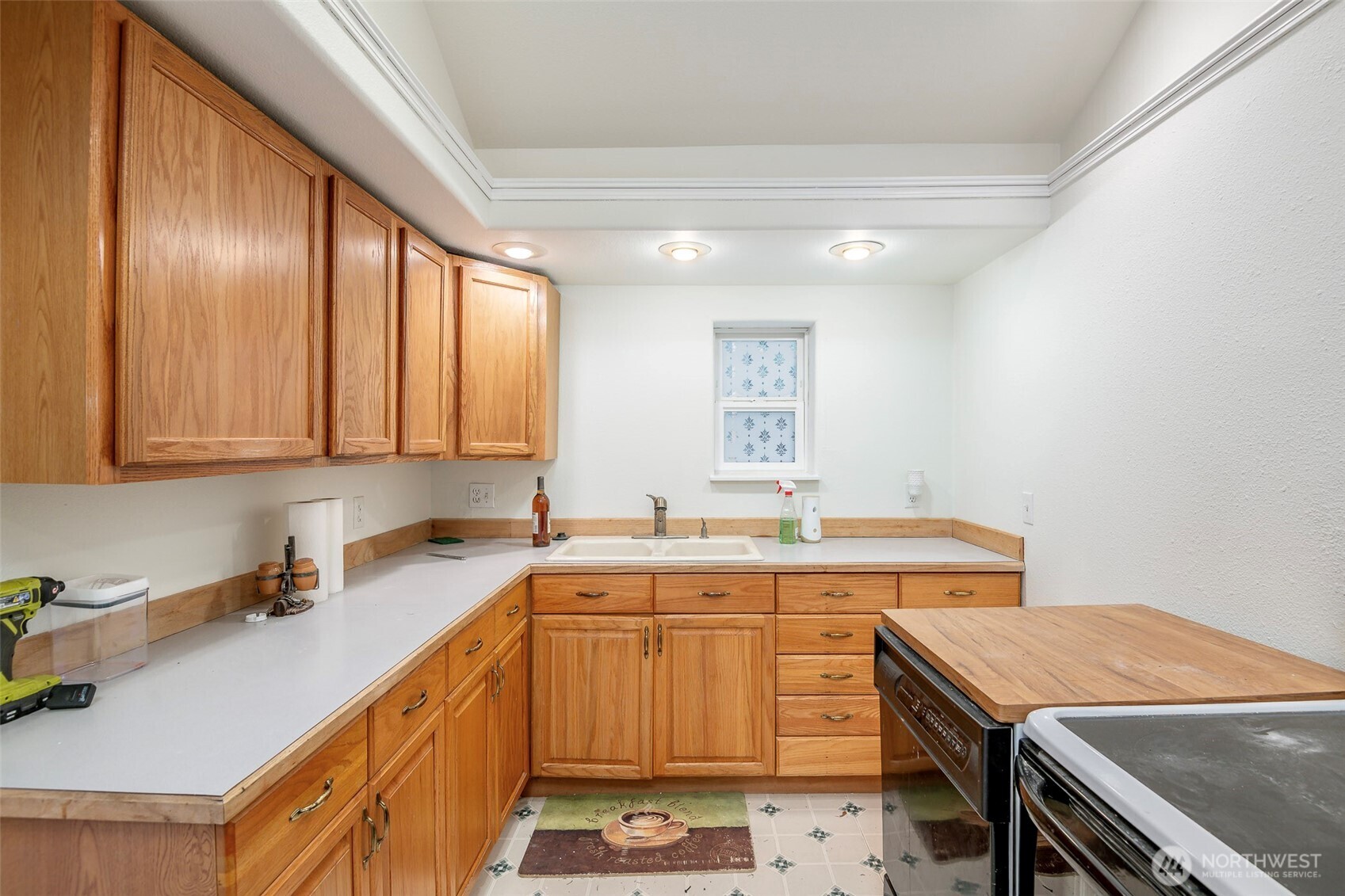 4048 Southeast Horstman Road Port Orchard, WA 98366 - Photo 8 of 40 a kitchen that has a sink a stove and a oven