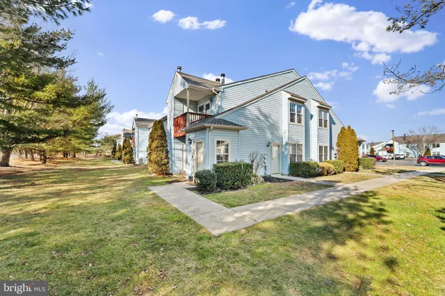 a view of an house with swimming pool and sitting area