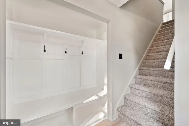 a view of staircase with white walls