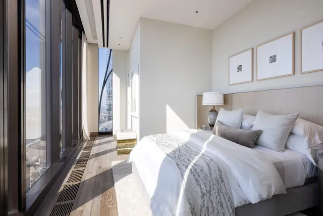 a view of a bathroom with mirror and window