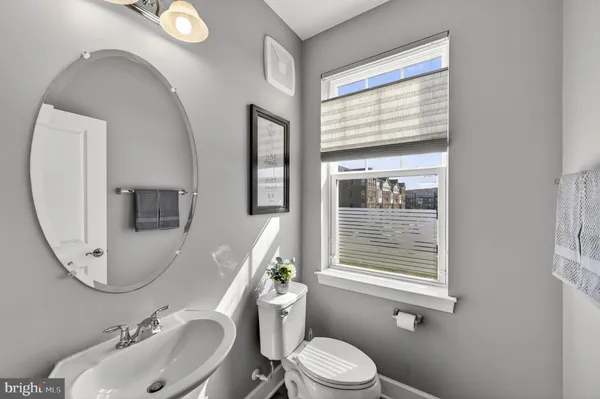 a view of a bathroom with a sink and mirror