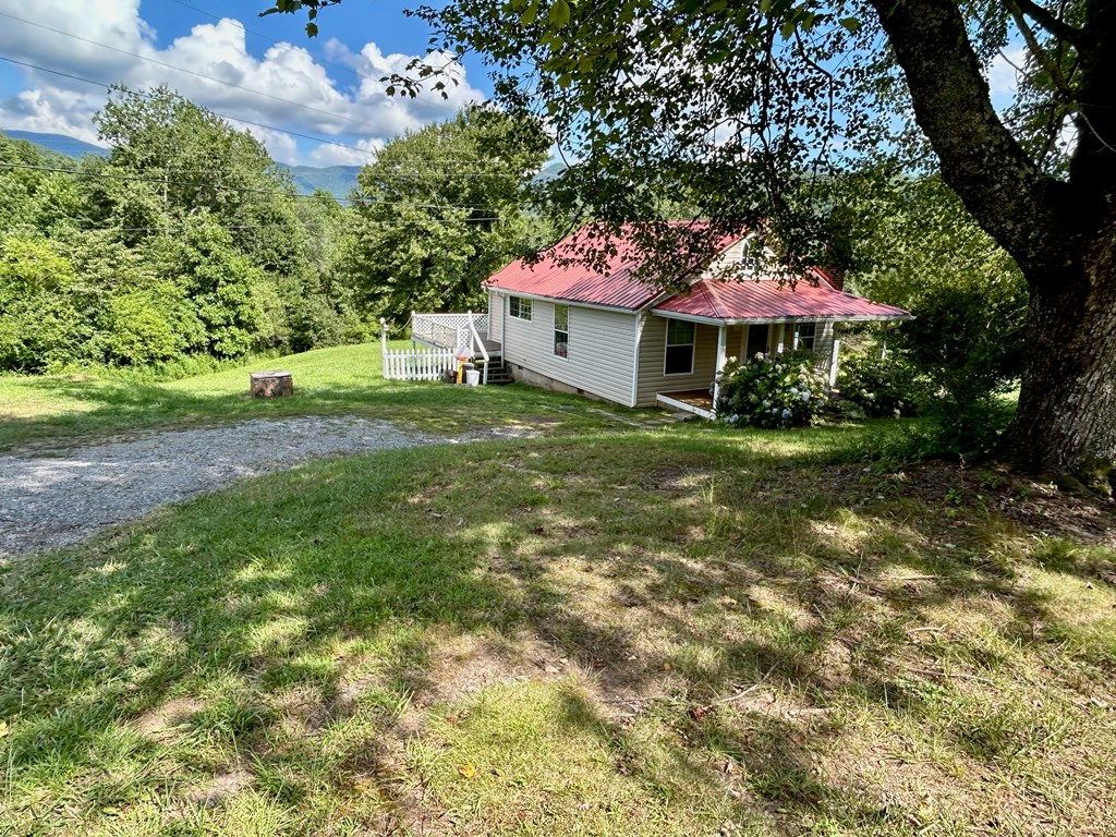 136 West Vineyard Road Hayesville, NC 28904 - Photo 14 of 17 a front view of house with yard and green space