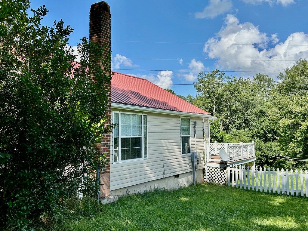 136 West Vineyard Road Hayesville, NC 28904 - Photo 15 of 17 a front view of a house with a garden