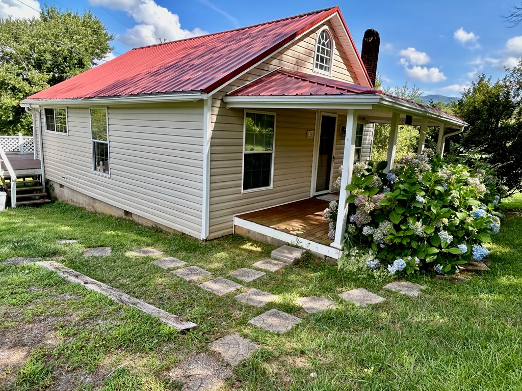 136 West Vineyard Road Hayesville, NC 28904 - Photo 17 of 17 a view of a house with backyard