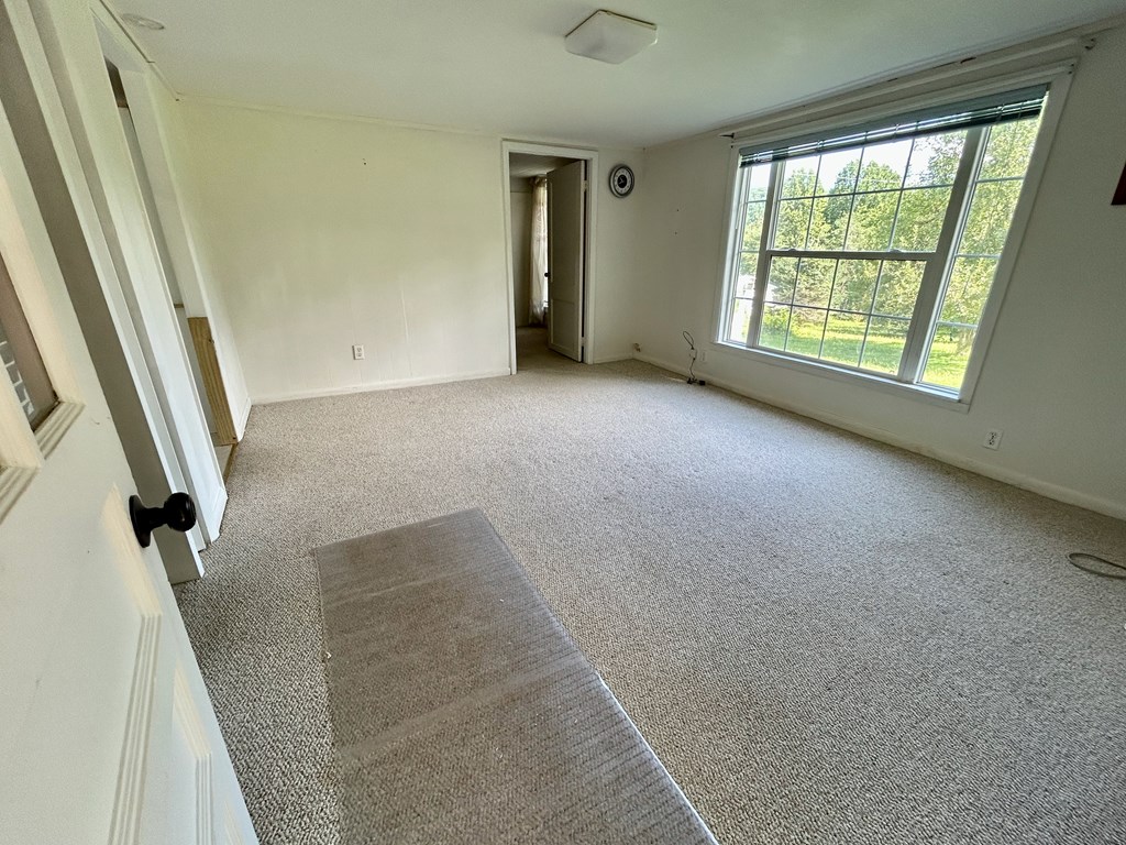 136 West Vineyard Road Hayesville, NC 28904 - Photo 3 of 17 an empty room with windows