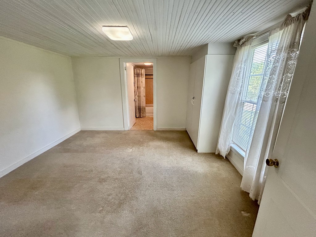 136 West Vineyard Road Hayesville, NC 28904 - Photo 5 of 17 an empty room with windows