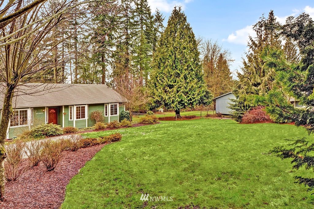 20223 Southeast 152nd Street Renton, WA 98059 - Photo 2 of 18 a front view of a house with a garden