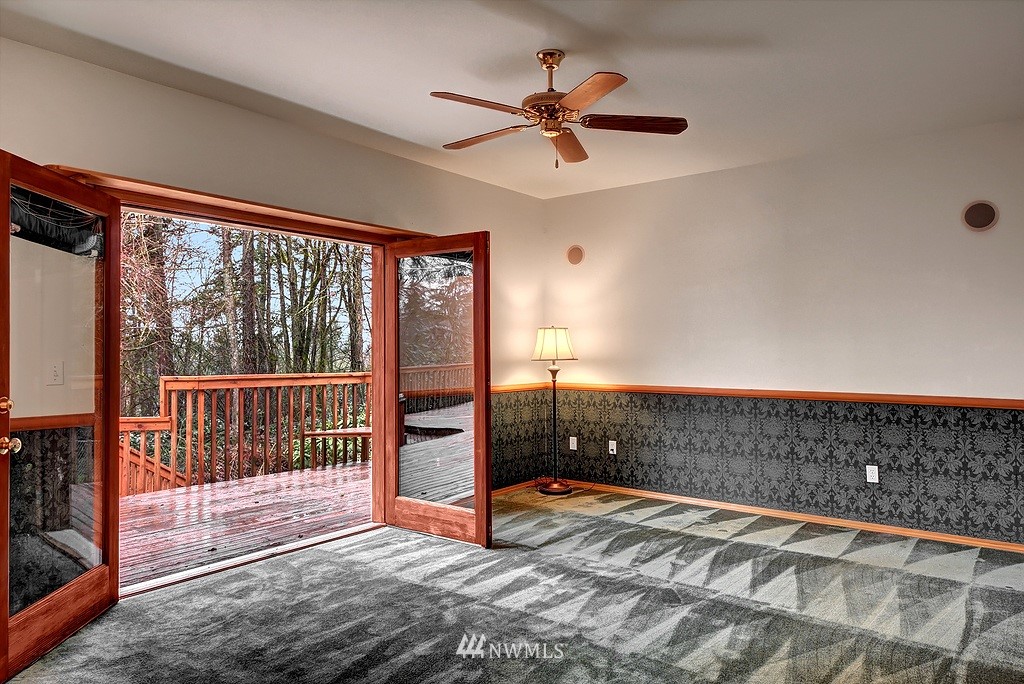 20223 Southeast 152nd Street Renton, WA 98059 - Photo 15 of 18 a view of a livingroom with a ceiling fan and window