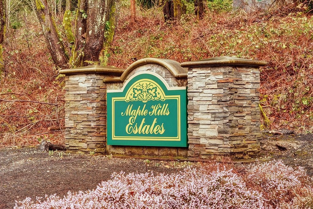 20223 Southeast 152nd Street Renton, WA 98059 - Photo 18 of 18 a sign that is on a brick wall