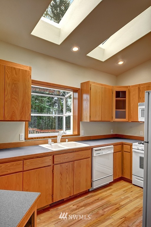 20223 Southeast 152nd Street Renton, WA 98059 - Photo 8 of 18 a kitchen with a sink stove and cabinets
