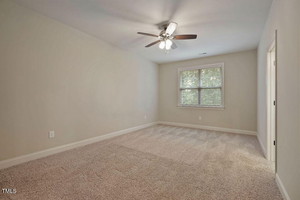 1124 Armsleigh Court Raleigh, NC 27603 - Photo 31 of 33 an empty room with windows and fan