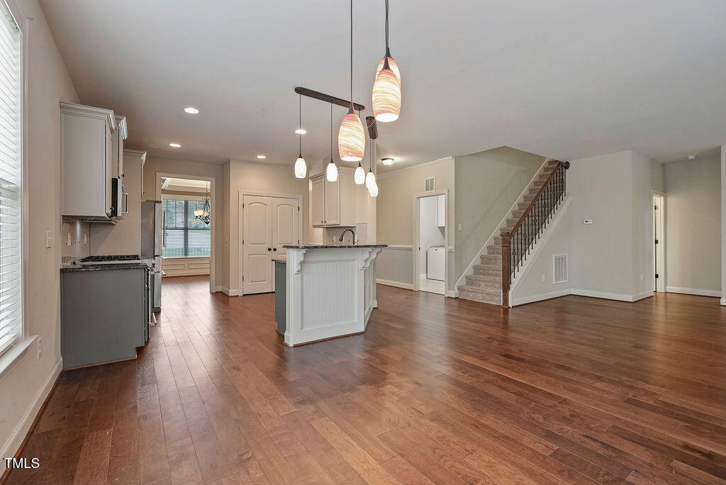 1124 Armsleigh Court Raleigh, NC 27603 - Photo 6 of 33 a view of a kitchen with cabinets and wooden floor