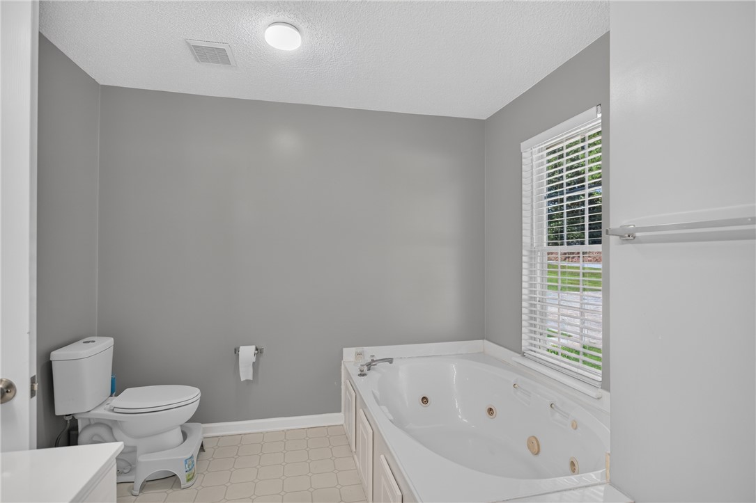 3336 Centerville Road Anderson, SC 29625 - Photo 27 of 50 Relax and unwind in this bathroom featuring a large soaking tub, offering a peaceful retreat.