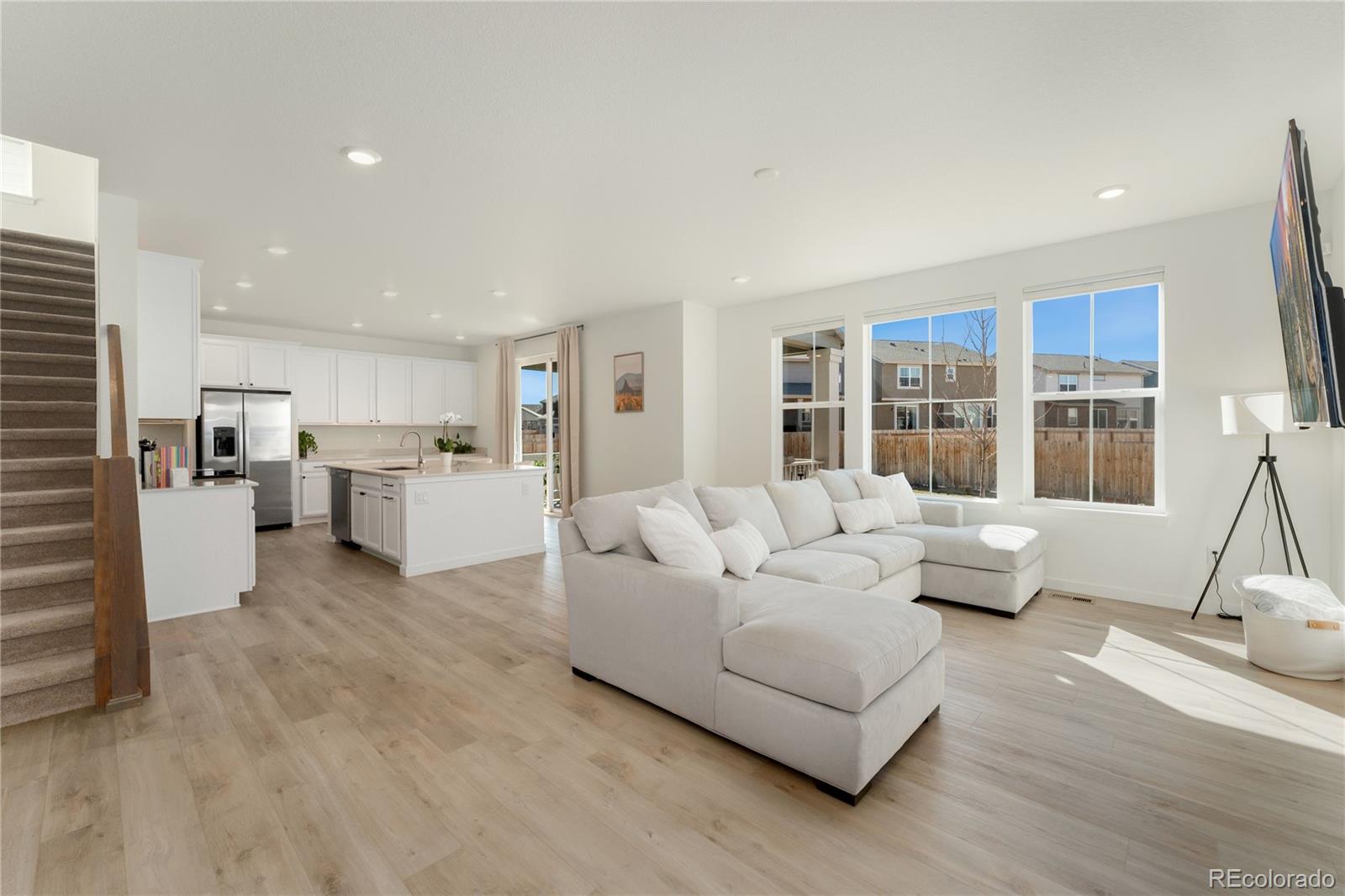 817 S Flat Aurora, CO 80018 - Photo 11 of 41 a living room with furniture and view of kitchen