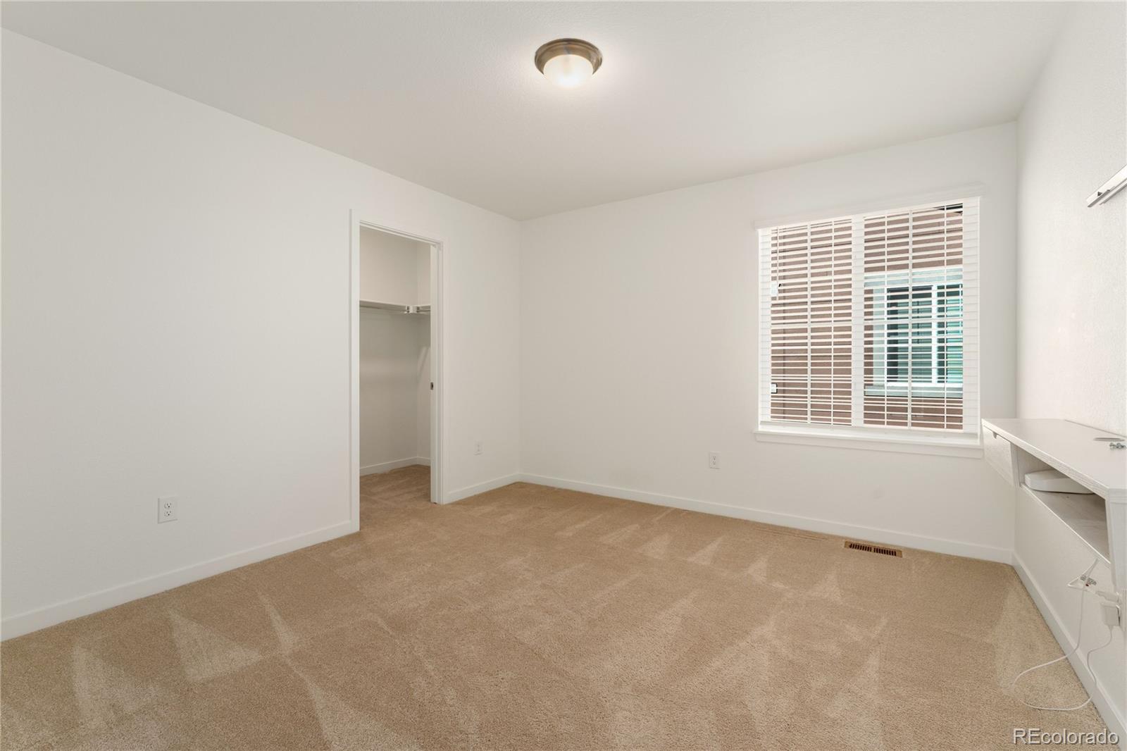 817 S Flat Aurora, CO 80018 - Photo 20 of 41 an empty room with windows