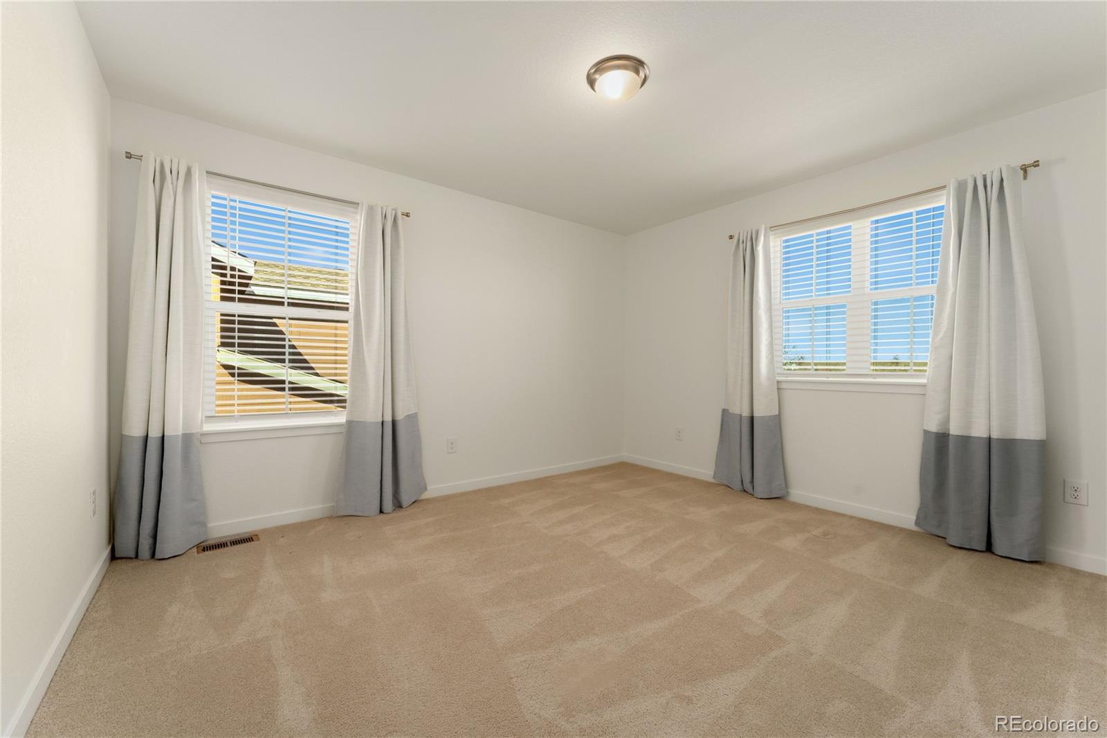 817 S Flat Aurora, CO 80018 - Photo 22 of 41 an empty room with windows