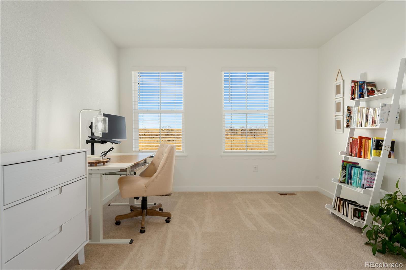 817 S Flat Aurora, CO 80018 - Photo 24 of 41 a view of a workspace with furniture and a window