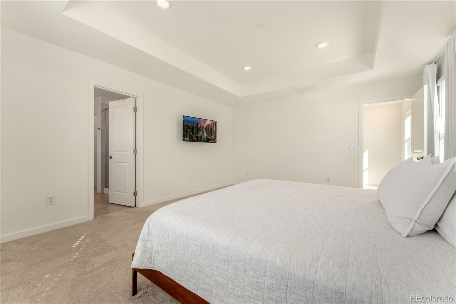 817 S Flat Aurora, CO 80018 - Photo 29 of 41 a bedroom with a bed and a chair