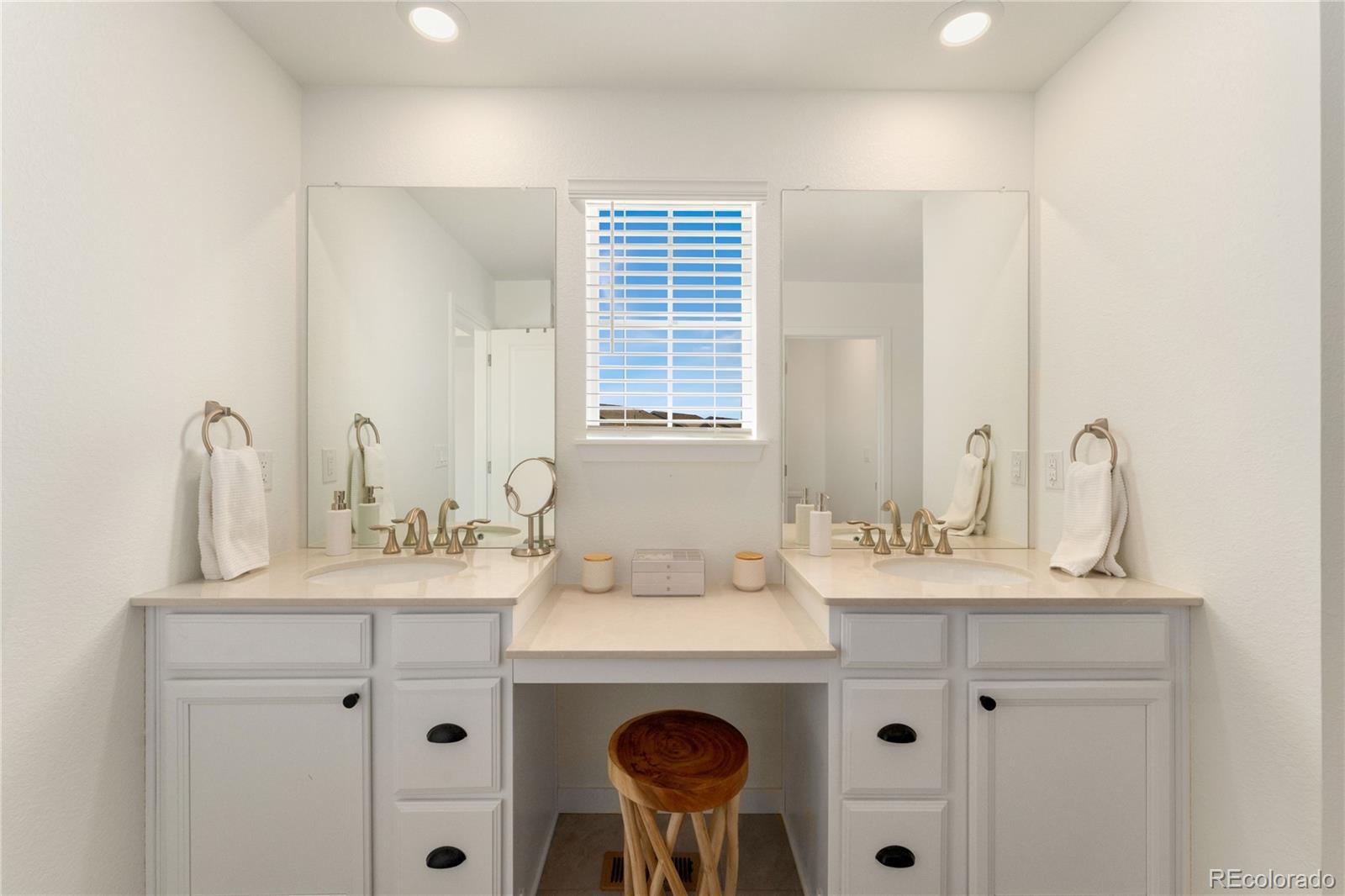 817 S Flat Aurora, CO 80018 - Photo 31 of 41 a bathroom with a sink and a mirror
