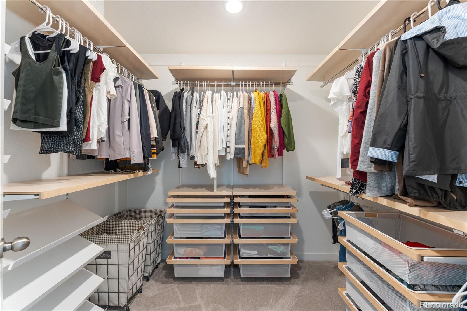 817 S Flat Aurora, CO 80018 - Photo 33 of 41 a view of walk in closet with clothes and shoes