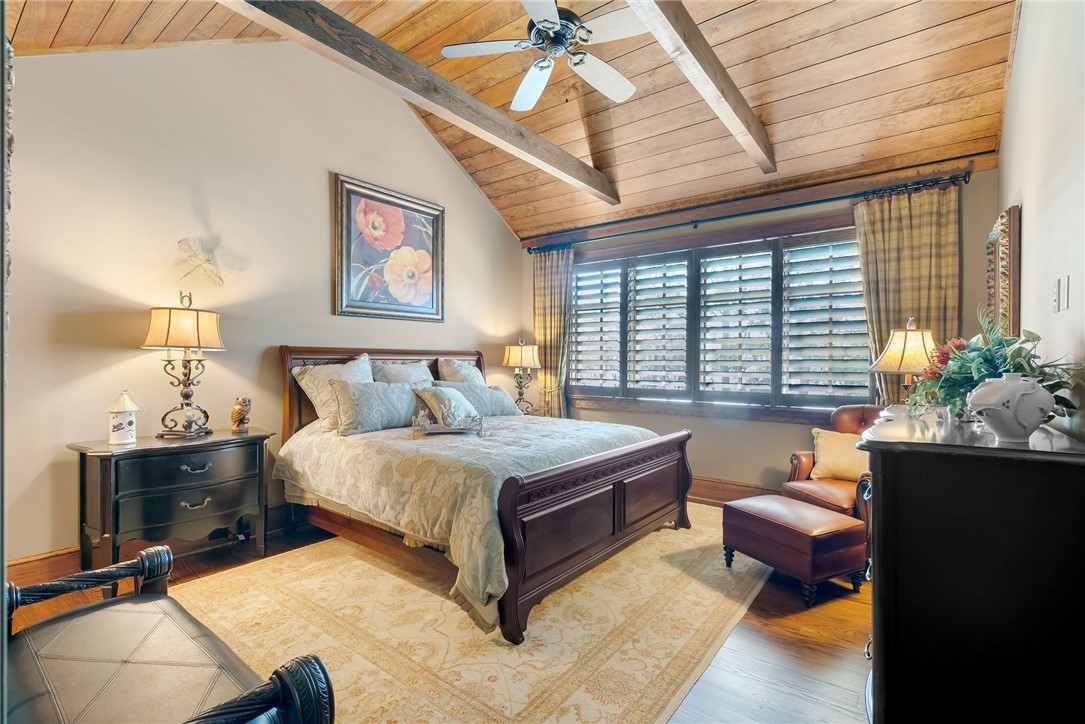 104 Crooked Stick Court Sunset, SC 29685 - Photo 27 of 43 This cozy bedroom features a vaulted ceiling and rich wooden floors.