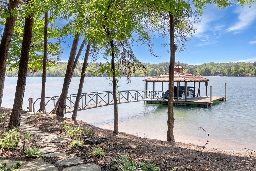 104 Crooked Stick Court Sunset, SC 29685 - Photo 30 of 43 This serene waterfront retreat offers direct lake access and a charming covered boat dock.