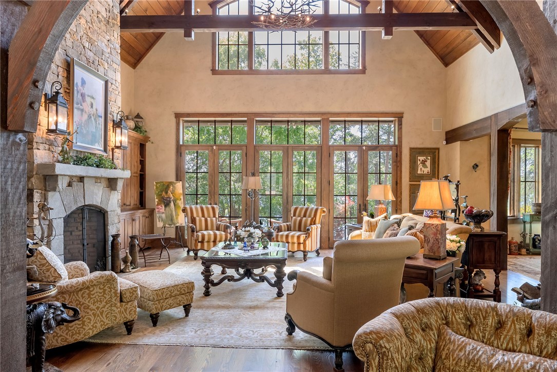 104 Crooked Stick Court Sunset, SC 29685 - Photo 3 of 43 This grand living room features a striking fireplace and expansive windows that offer captivating views.