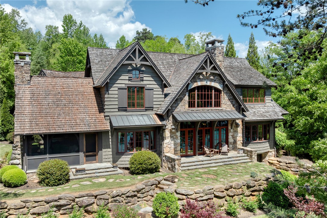 104 Crooked Stick Court Sunset, SC 29685 - Photo 32 of 43 This magnificent residence features exquisite stone and wood craftsmanship set amidst a lush, verdant landscape.