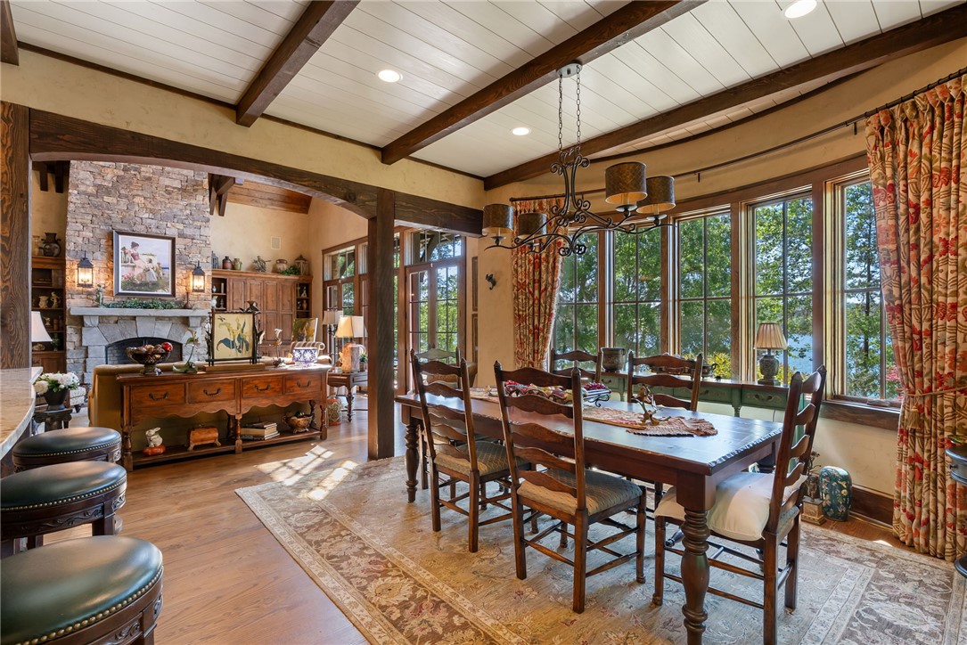 104 Crooked Stick Court Sunset, SC 29685 - Photo 5 of 43 This inviting dining area features natural light, a wood-beamed ceiling, and ample space for gatherings.