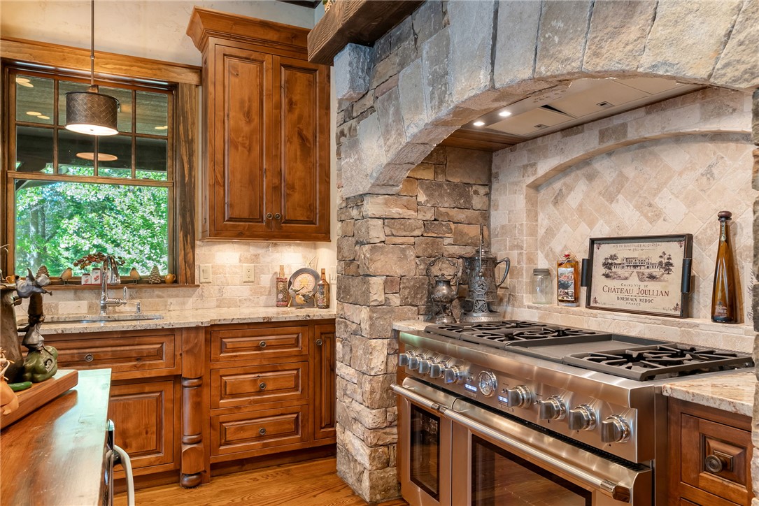 104 Crooked Stick Court Sunset, SC 29685 - Photo 10 of 43 This kitchen blends rustic stone accents with high-end appliances for a timeless aesthetic.