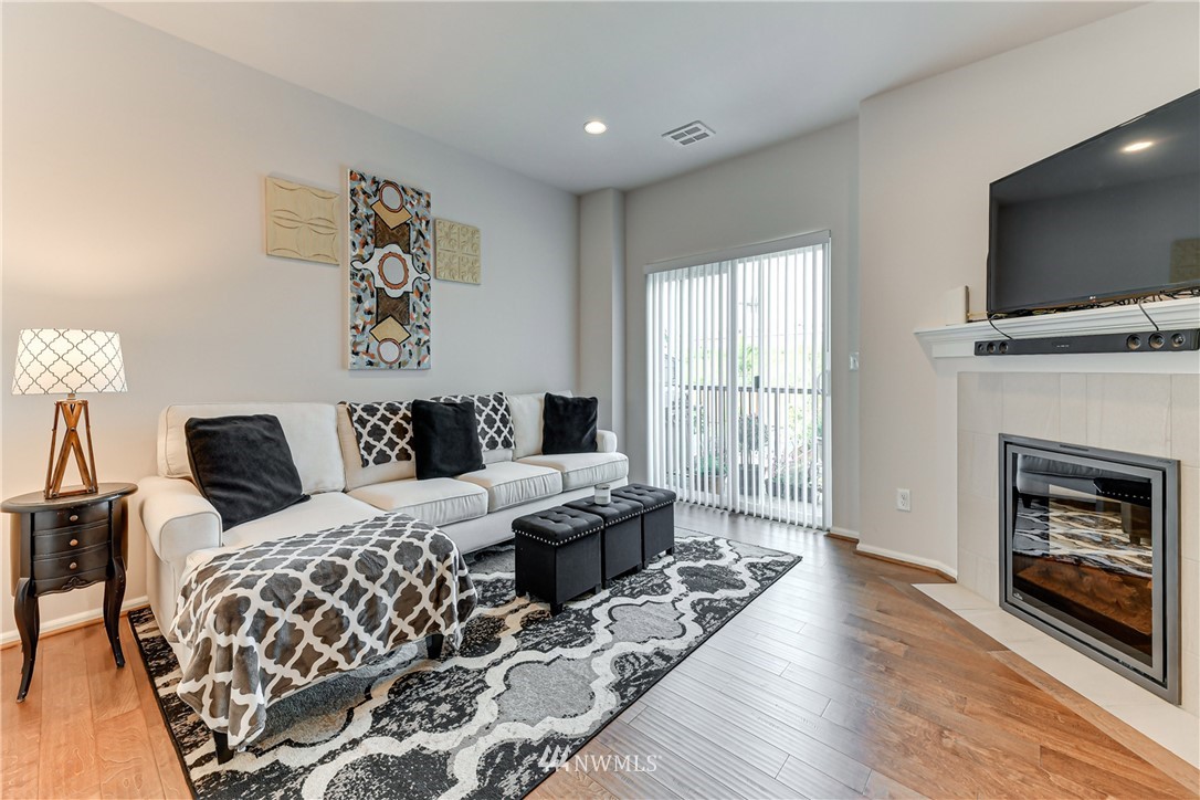 3337 30th Drive Everett, WA 98201 - Photo 11 of 28 a bedroom with a bed and a flat screen tv