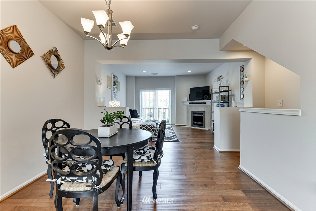 3337 30th Drive Everett, WA 98201 - Photo 14 of 28 a view of a dining room with furniture and wooden floor