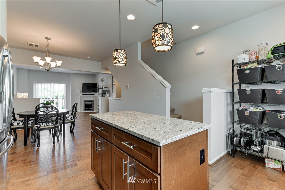 3337 30th Drive Everett, WA 98201 - Photo 20 of 28 an open kitchen with furniture and wooden floor