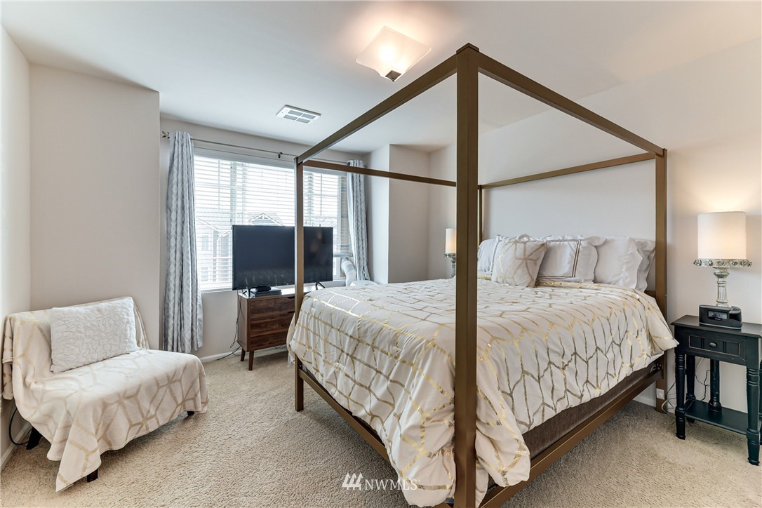 3337 30th Drive Everett, WA 98201 - Photo 23 of 28 a bedroom with a bed and a flat screen tv