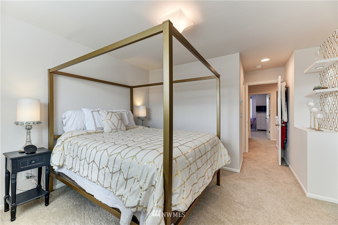 3337 30th Drive Everett, WA 98201 - Photo 24 of 28 a bedroom with a bed and a lamp