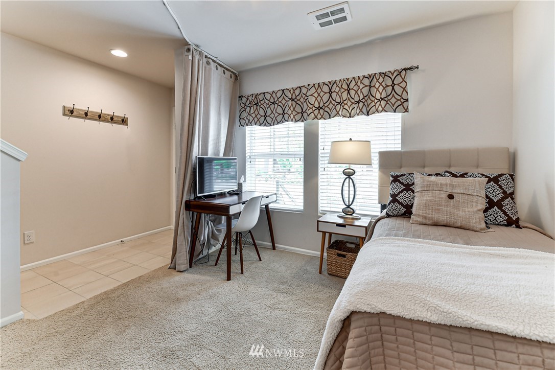 3337 30th Drive Everett, WA 98201 - Photo 6 of 28 a bedroom with furniture and a large window