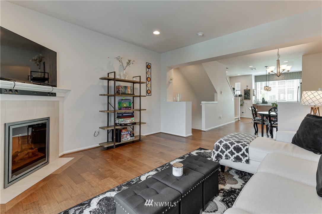 3337 30th Drive Everett, WA 98201 - Photo 10 of 28 a living room with furniture a flat screen tv and a fireplace