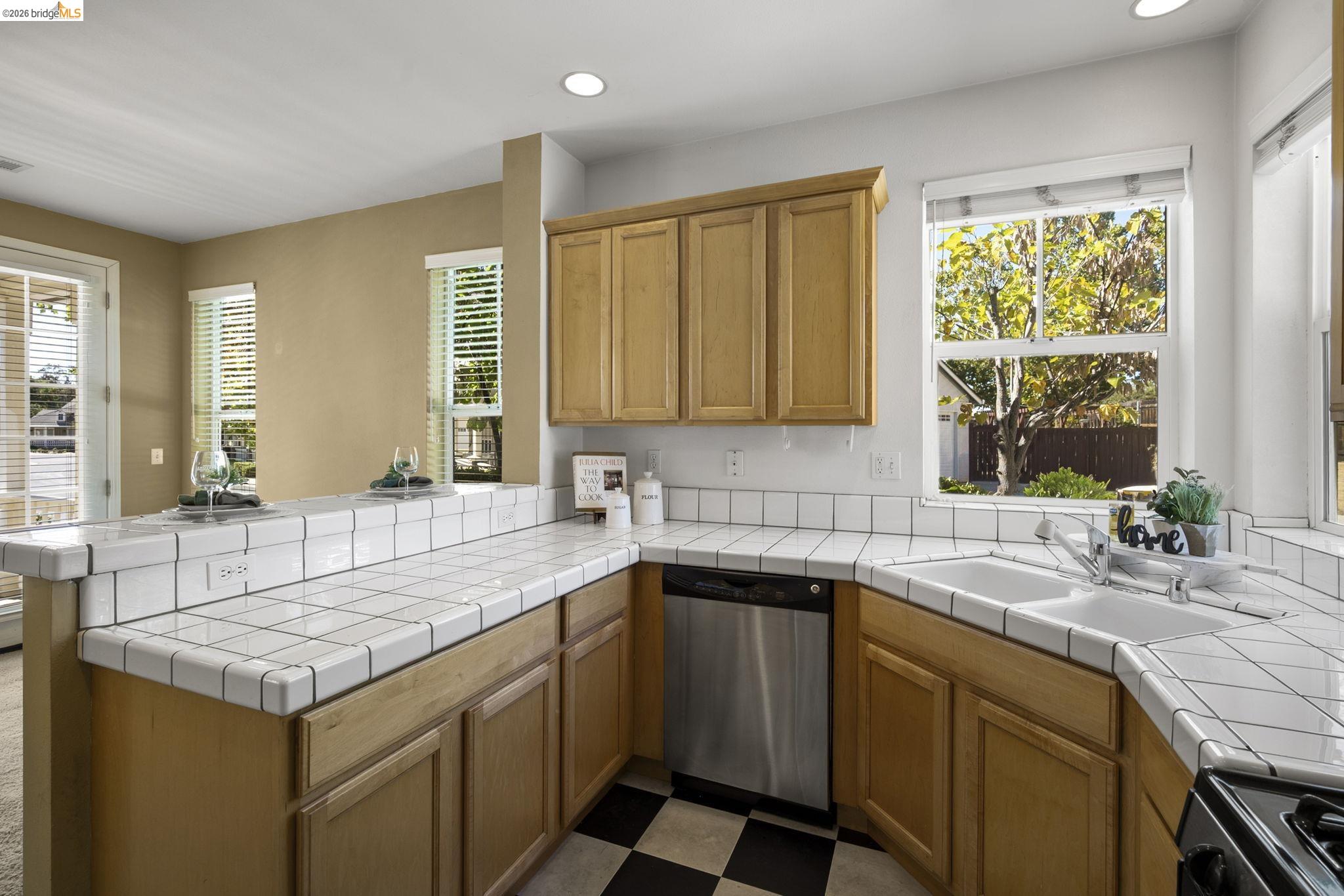 343 Field Stone Drive Murphys, CA 95247 - Photo 16 of 40 a kitchen with a sink stove and cabinets