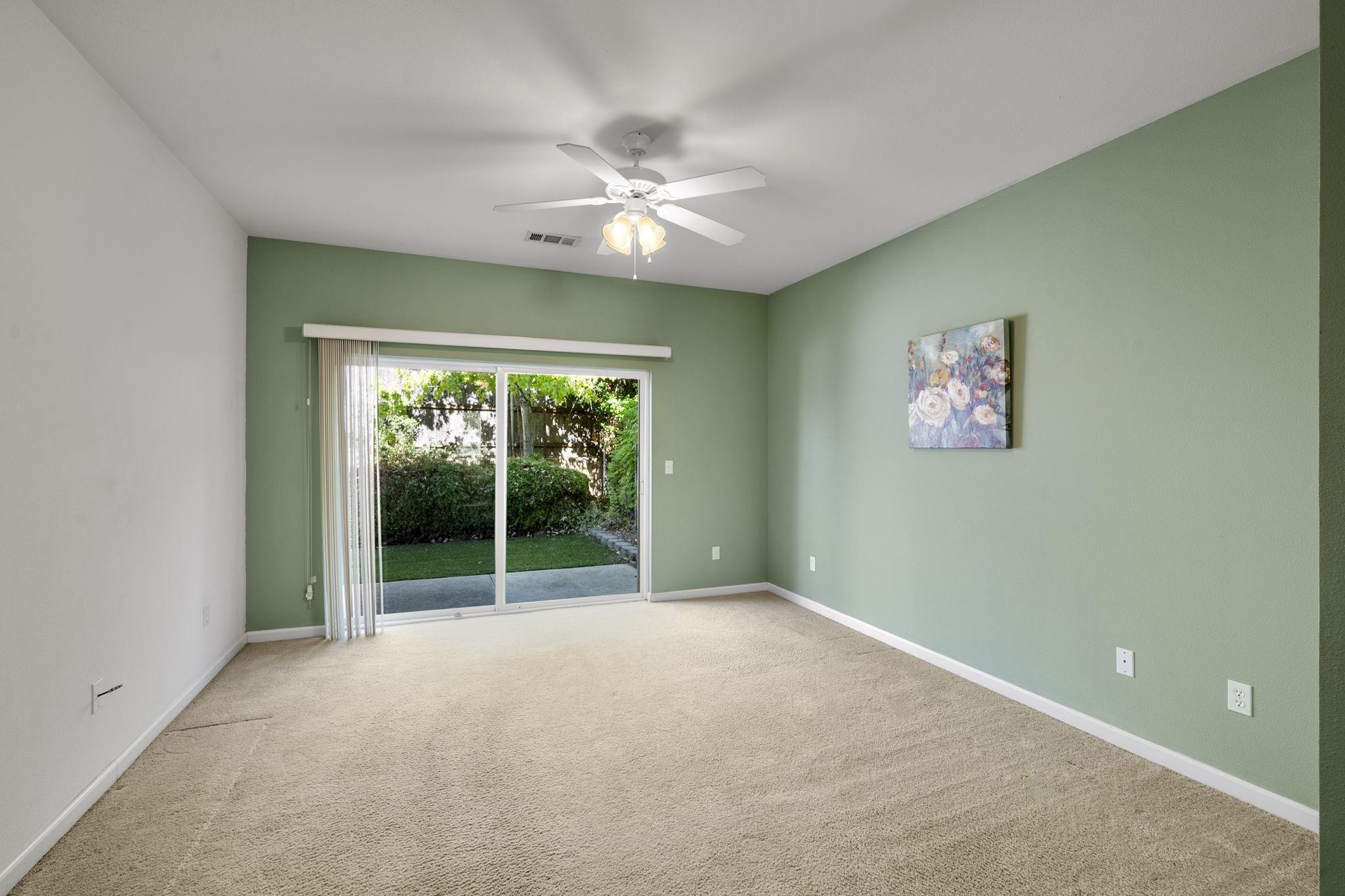 343 Field Stone Drive Murphys, CA 95247 - Photo 19 of 40 Primary Bedroom Suite on main level with view of slider to back patio