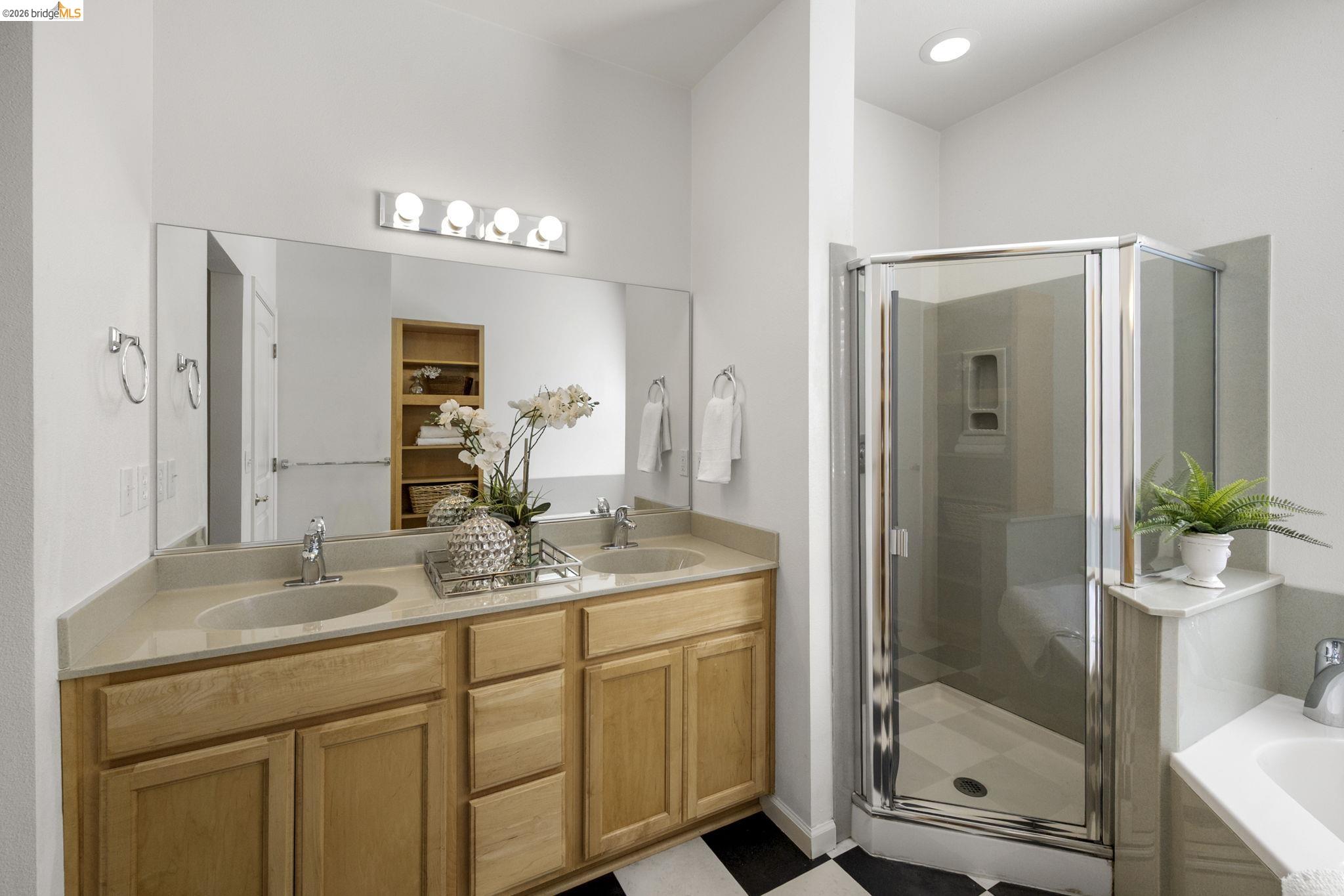 343 Field Stone Drive Murphys, CA 95247 - Photo 21 of 40 a bathroom with a granite countertop sink a mirror and a shower