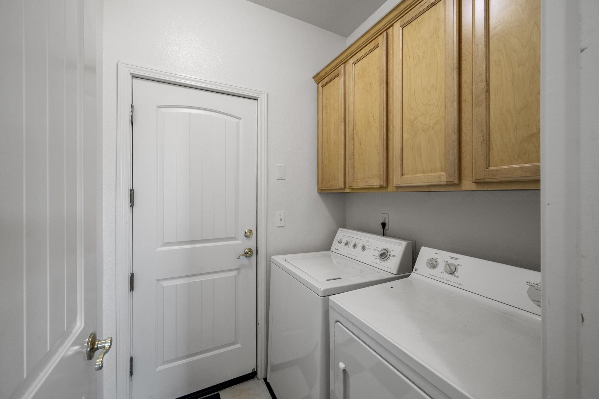 343 Field Stone Drive Murphys, CA 95247 - Photo 24 of 40 Laundry room featuring washer and dryer and cabinet space